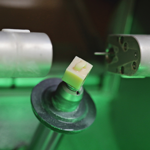 Close up of ceramic block in CEREC machine