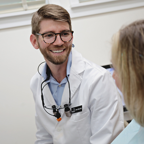 Langley dentist Dr. Talbot speaking to a patient